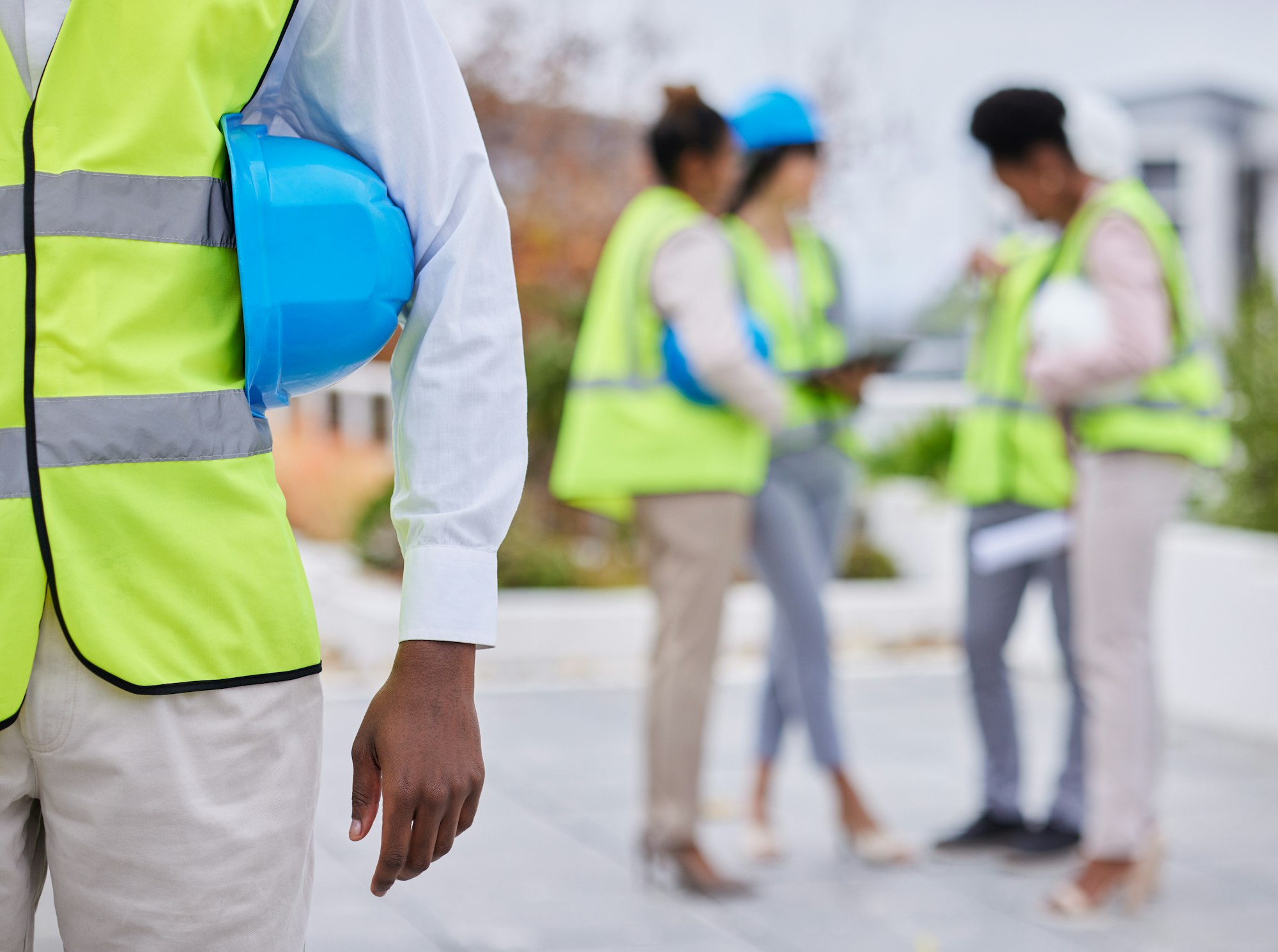 Construction worker team, man and helmet in mockup with planning vision, strategy or blueprint for